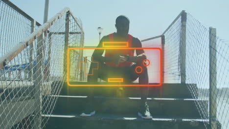 man sitting on outdoor steps with battery and controller animation overlay