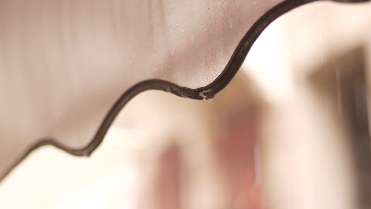 Water Droplets Dripping from an Awning in the Rain