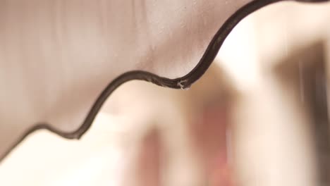 Water Droplets Dripping from an Awning in the Rain