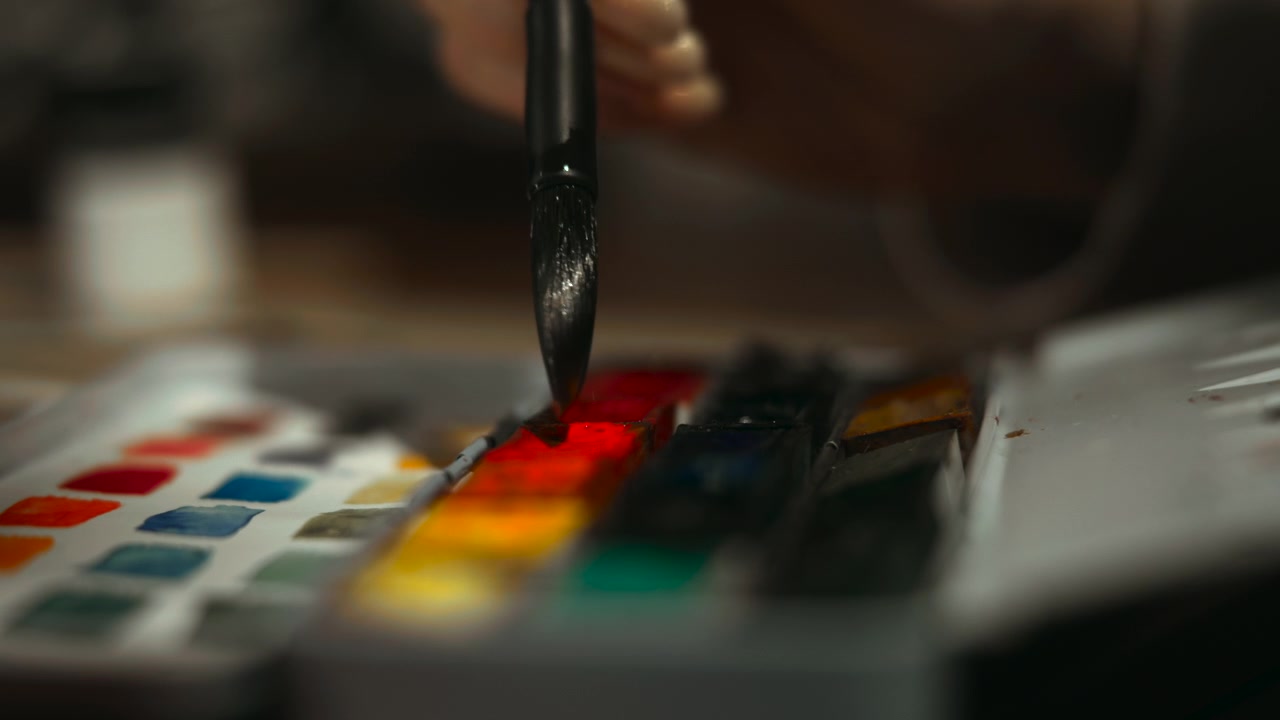 Wet Watercolor Palette With Vibrant Pans And Brush Tip Picking Pigment, Shallow Depth Of Field And Creative
