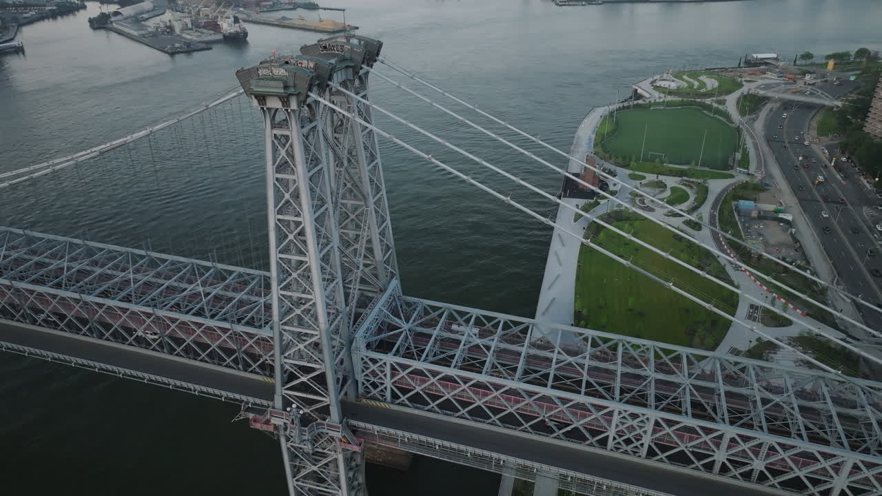 Aerial view of the Williamsburg Bridge and the East River on an overcast day