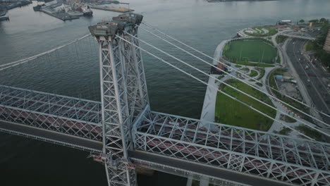 aerial view of the williamsburg bridge and the east river on an overcast day