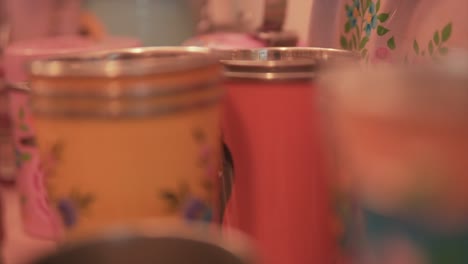 close-up-shot-of-colorful-steel-dustbins-on-a-shop