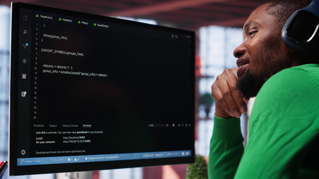 Vertical Video Young IT engineer typing code on computer and running script