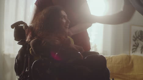 mother supporting her daughter in a wheelchair
