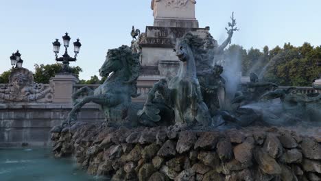 close up details of the fountain of the girondains monument in bordeaux during sunrise with nobody