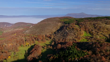 autumn mountain landscape with valley fog