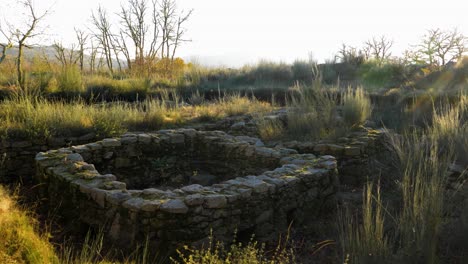 Wide-angle-establishing-view-of-Castro-fort-rock-walls-at-golden-hour