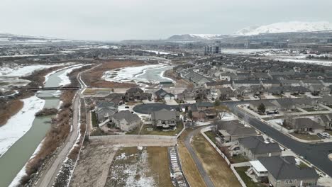 suburb in lehi, utah near thanksgiving point and silicon slopes - aerial panorama in winter