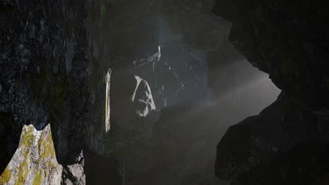 vertical shot of tropical cave at sunset