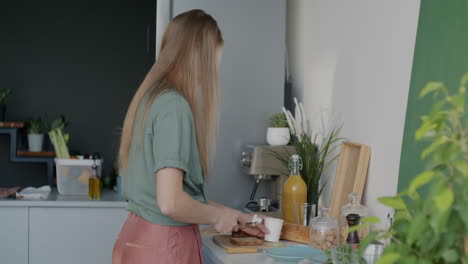 woman making breakfast sandwich