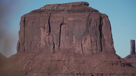 young man walking out to overlook in monument valley arizona, slow motion