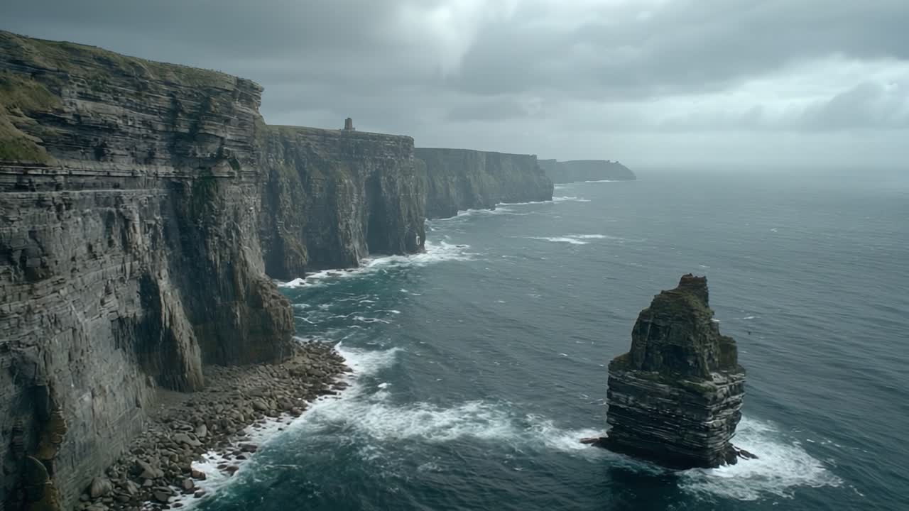 A Dramatic Coastal View Featuring Majestic Cliffs, Towering Rock Formations, and Turbulent Ocean Waves Under a Gloomy Overcast Sky