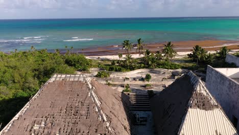 drone video of a ruin of a luxury hotel on a tropical beach after destruction by a hurricane