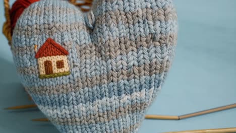 knitted heart with house embroidery and yarn