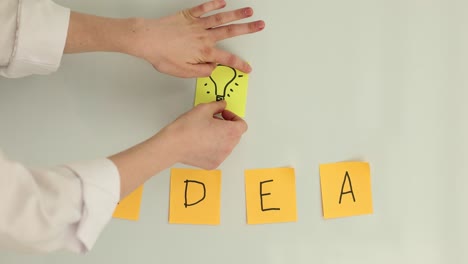 Idea Concept with Lightbulb and Sticky Notes