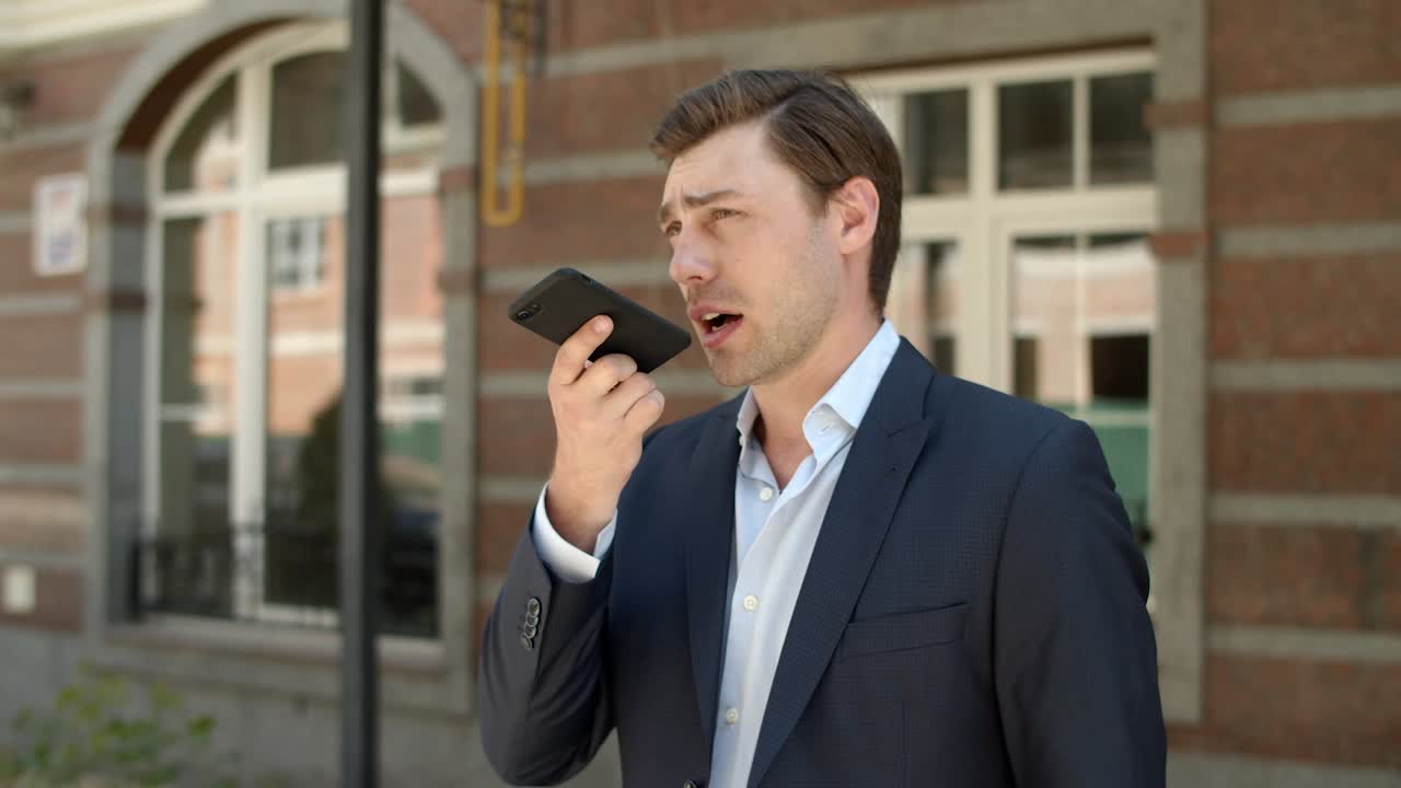 Closeup businessman talking phone outdoor. Businessman having phone conversation