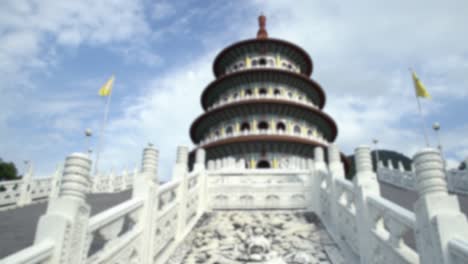 blurred defocused tian yuan temple in tamsui. tall pagoda temple of heavens