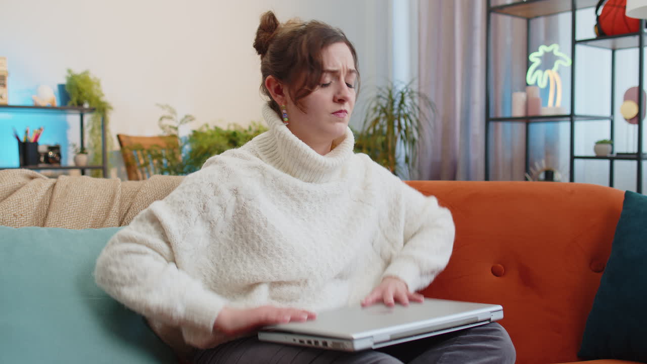 Pretty young woman use laptop surprised by bad news fortune loss fail lottery results at home