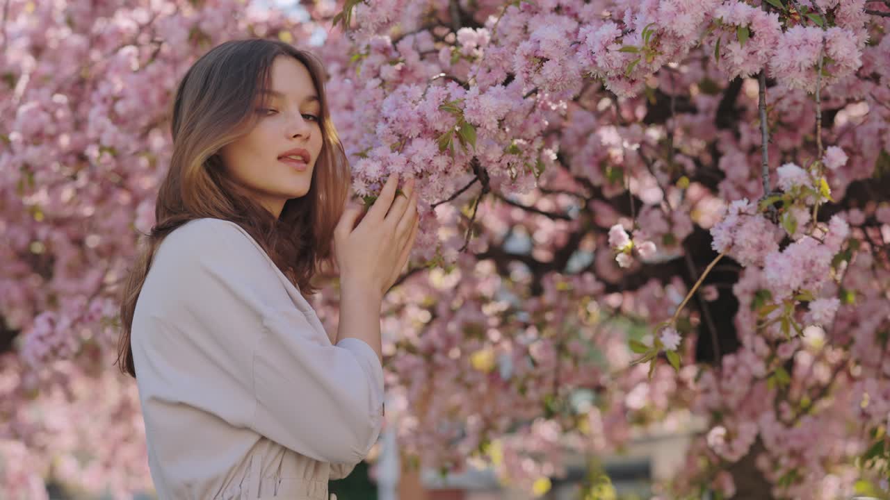 Woman enjoying cherry blossoms in spring