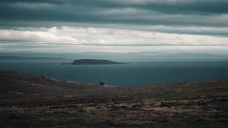 A-small-silitary-cabin-on-the-desolate-fjord-coastline