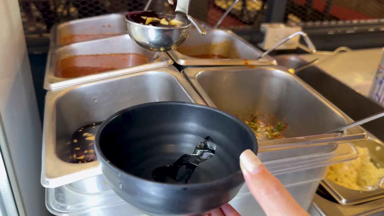 A sequence of sauce preparation for Korean BBQ in a Bangkok restaurant, showcasing ingredients and mixing techniques