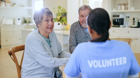 volunteer, senior man and woman in talk