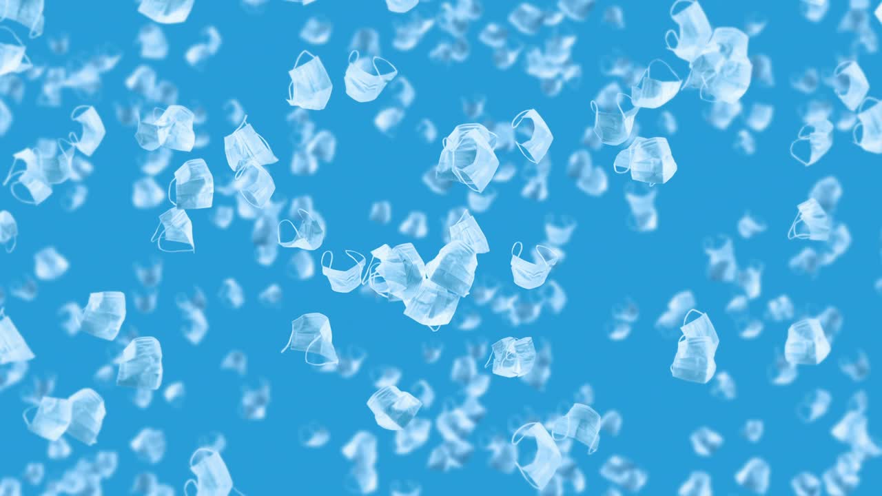 파란색 바탕에 많은 색 마스크를 날리는 의료 개념, 수술 보호 마스크, 마스크 회전의 3d 애니메이션, 루프 애니메이션.