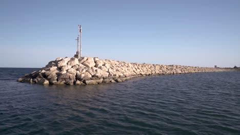 a boat sailing out of the pot in cyprus larnaca marina