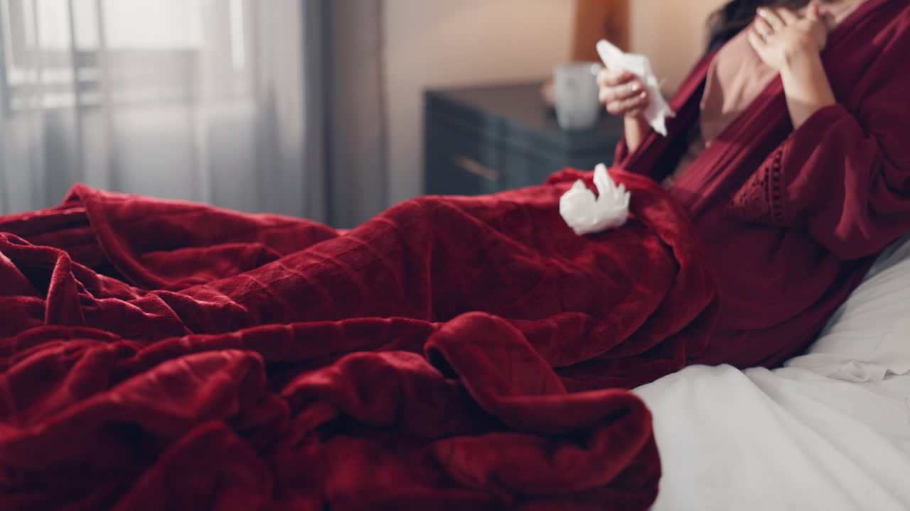 Woman Resting in Bed with a Cold