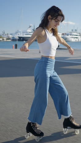 young woman rollerblading by the harbor