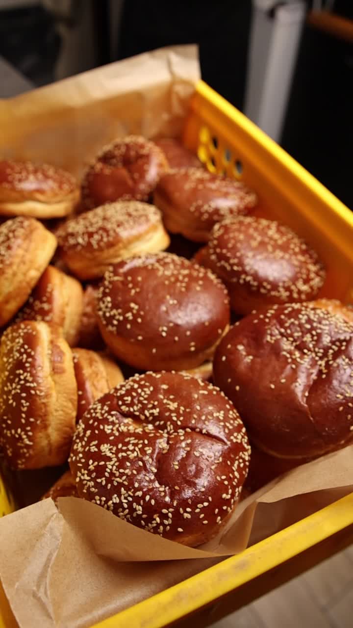 Freshly Baked Buns and Croissants in a Yellow Crate