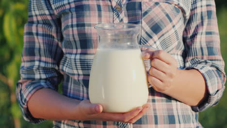 A-Farmer-Holds-A-Jug-Of-Milk-Healthy-Organic-Food