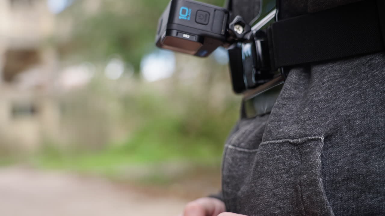 Man's Hands Operating a Handheld Camera Gimbal