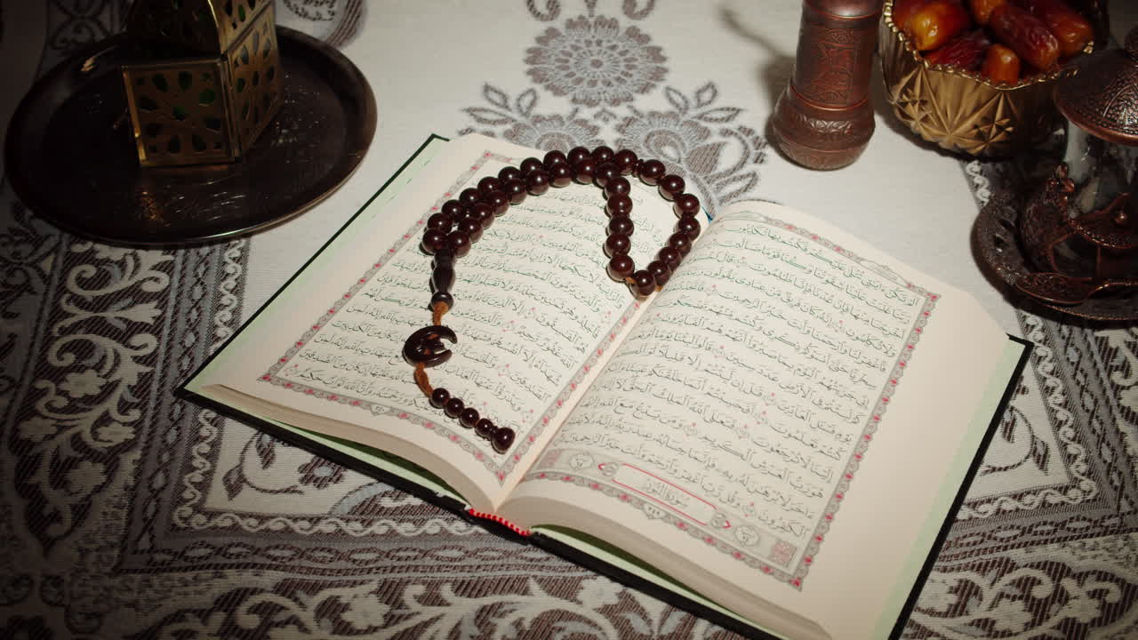 Quran book close-up, praying, islamic religion. Religious holiday Ramadan, holy month. Worship, making traditional prayer to God