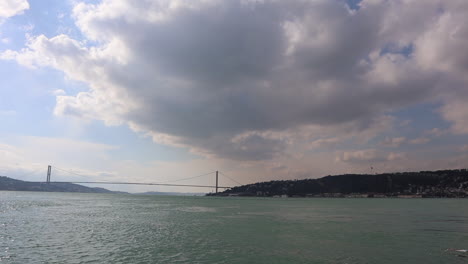 fatih sultan mehmet bridge, second bosphorus bridge spanning bosphorus strait with overcast in istanbul, turkey