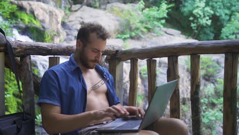 busy busy businessman working with laptop outdoors.