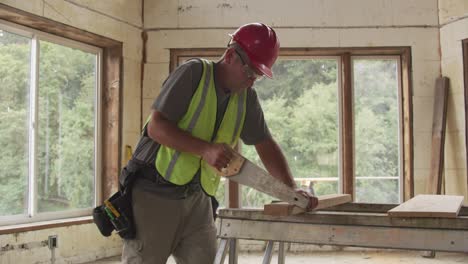 construction worker cutting board with hand saw