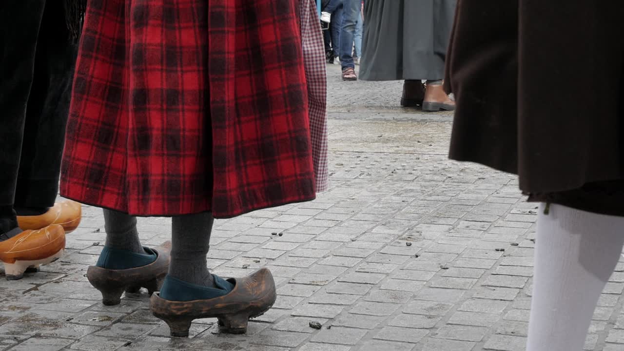 Static shot of clogs and red black skirt, traditional clothes, Madrid to Trashumancia festival, copy space