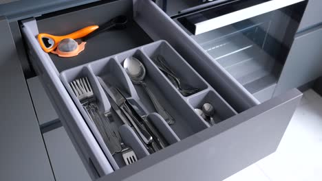 organized kitchen drawer with cutlery