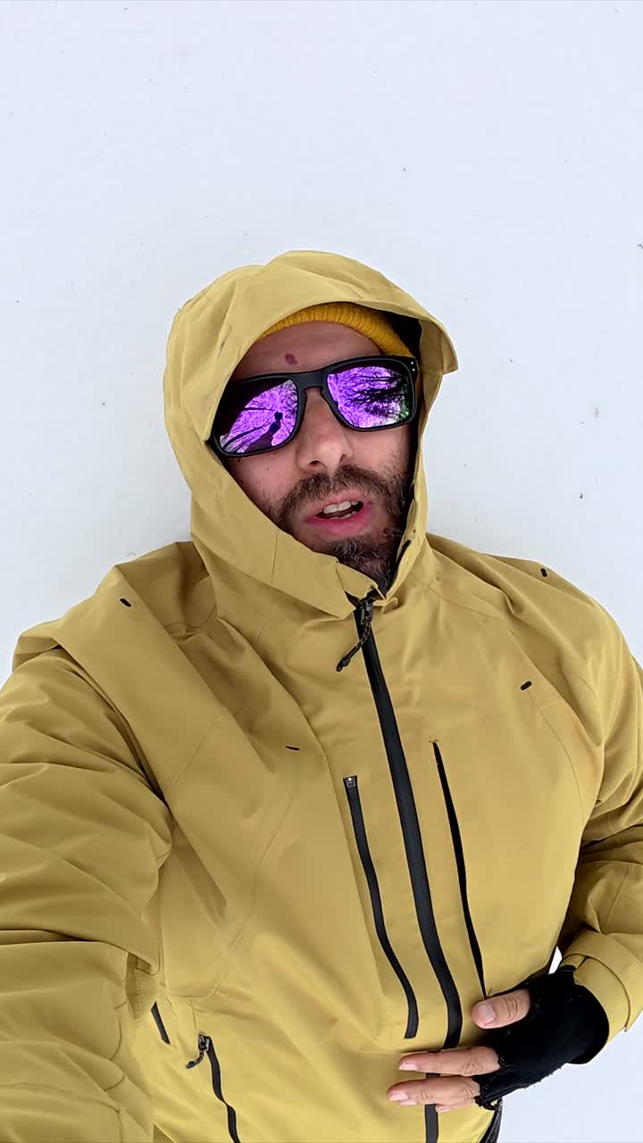 Man in Snow with Sunglasses