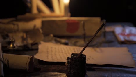 writing with historical period items by candlelight.