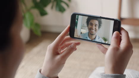 young woman using smartphone having video chat with deaf boyfriend communicating using sign language hand gestures enjoying online communication