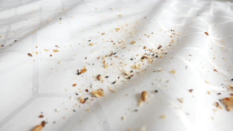 bread crumbs on a white tablecloth