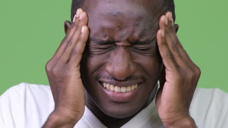 young african man having headache