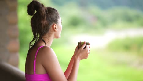 woman enjoying a drink outdoors