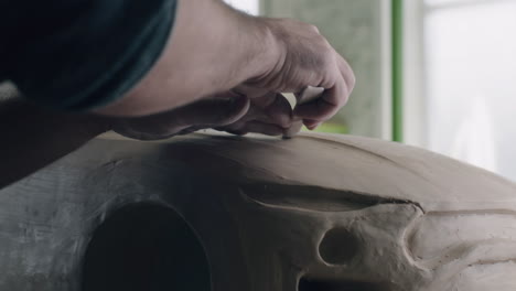 sculpting a car model in clay