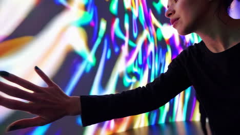 people interacting with a vibrant digital art light installation