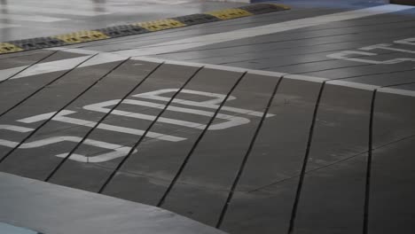 stop sign and speed bump on a sloped road surface