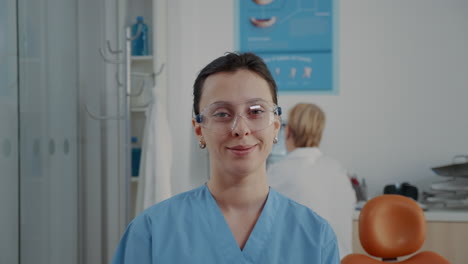 Portrait-of-orthodontic-nurse-looking-at-camera-in-dentistry-office